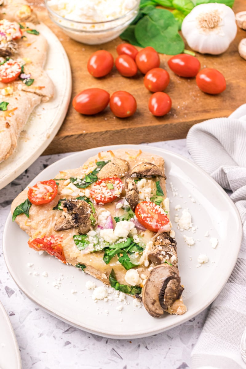 slice of pizza on a white plate