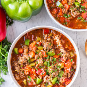 stuffed pepper soup in white bowls