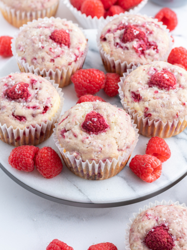 sugar crusted raspberry muffins on a serving tray