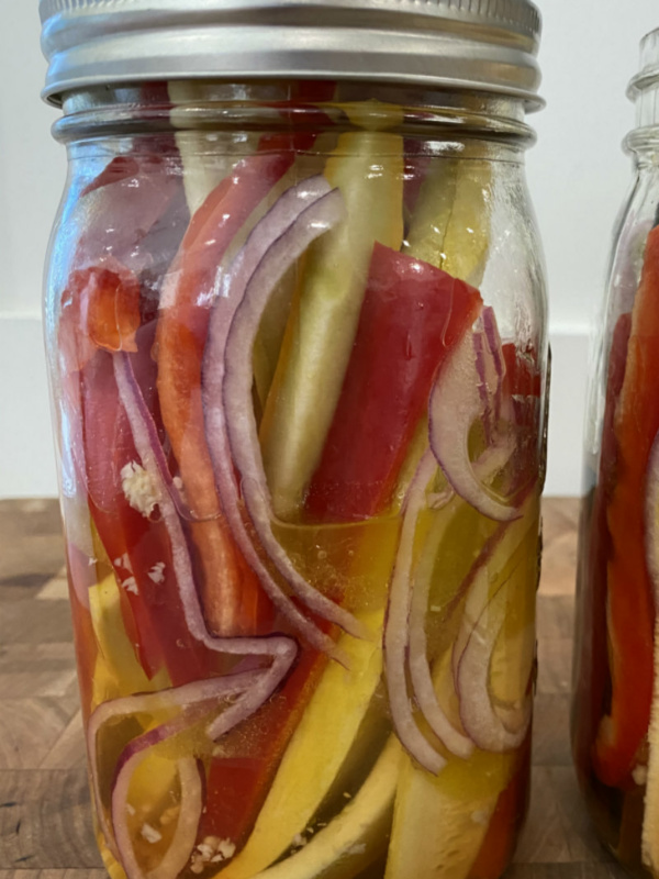 sweet and sour summer vegetables marinating in a jar