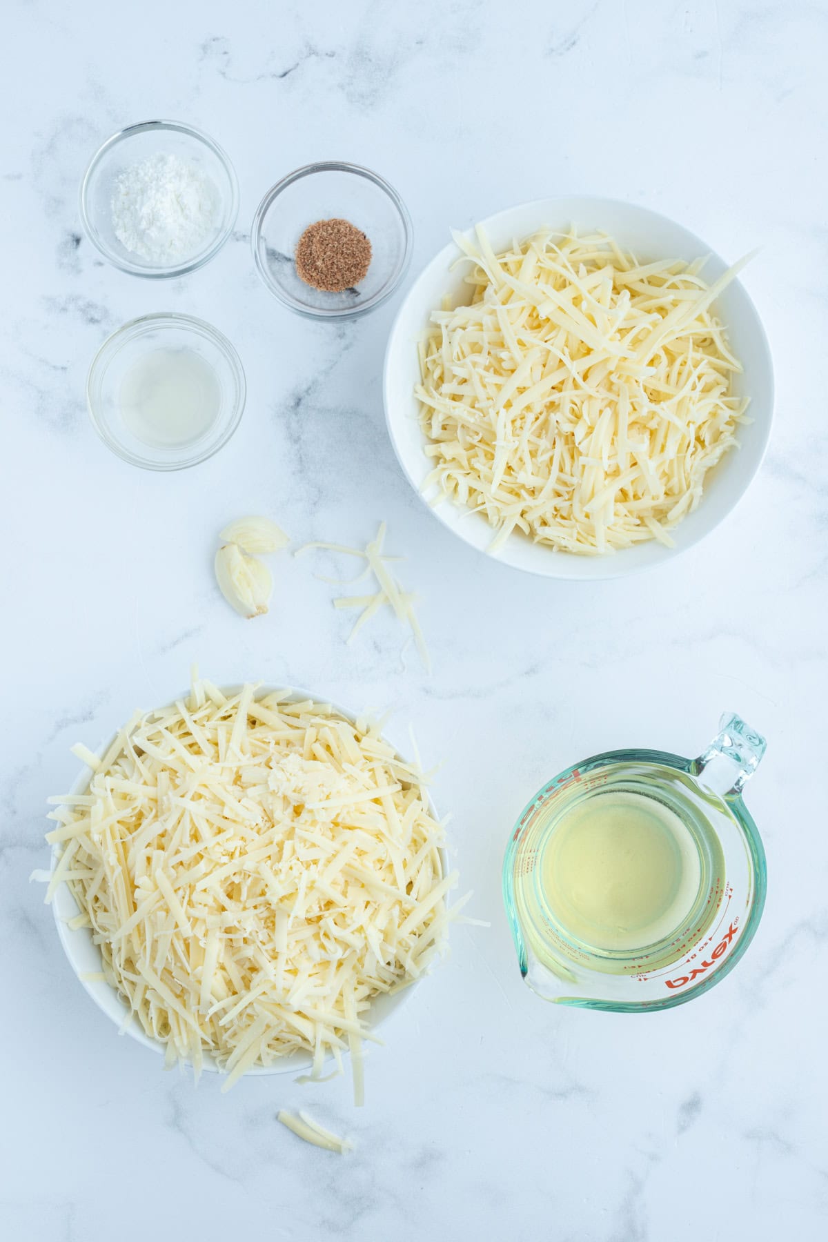 ingredients displayed for making swiss cheese fondue