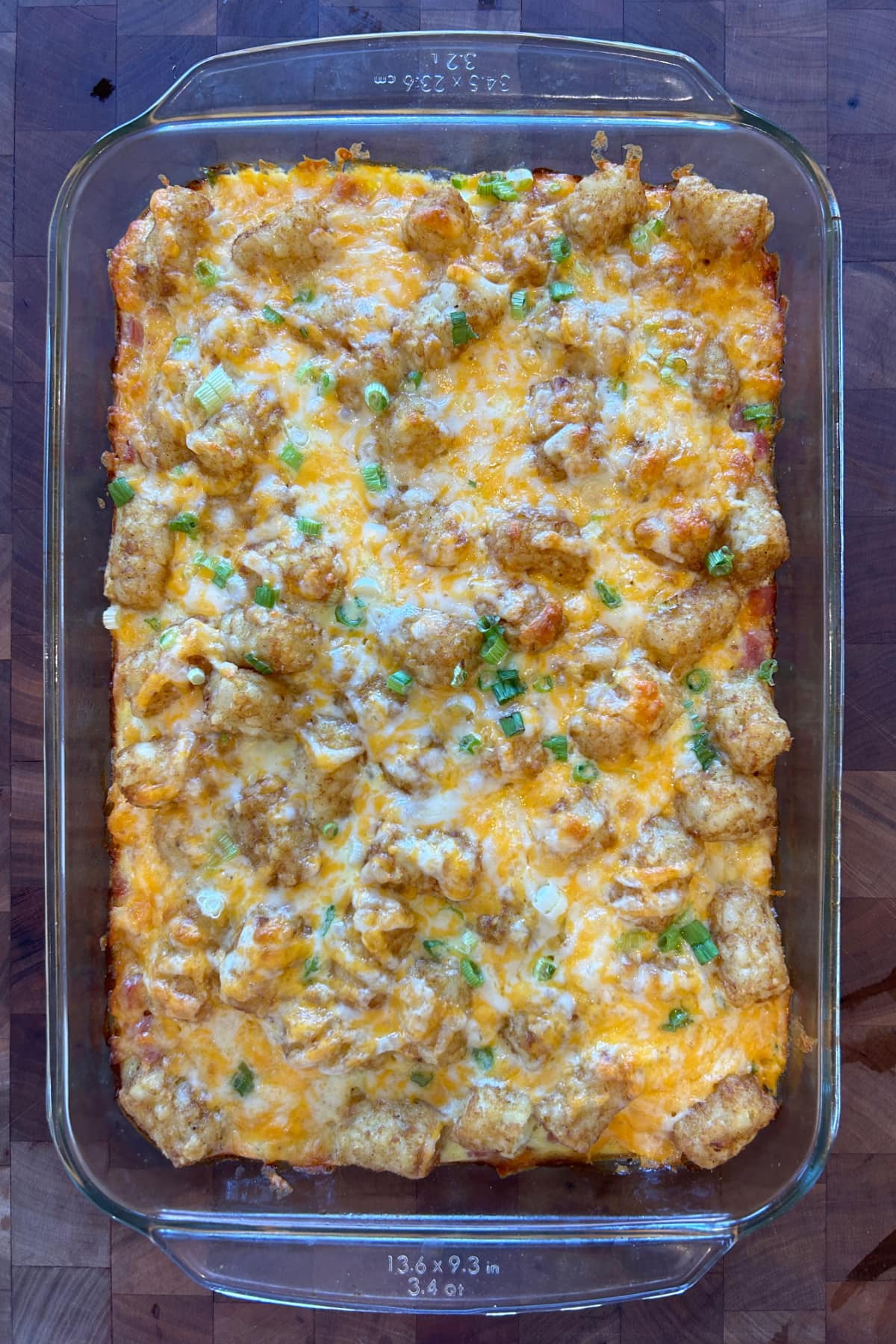 overhead shot of tater tot breakfast casserole in dish