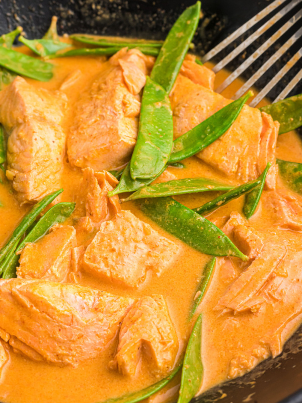 thai coconut red curry salmon in skillet