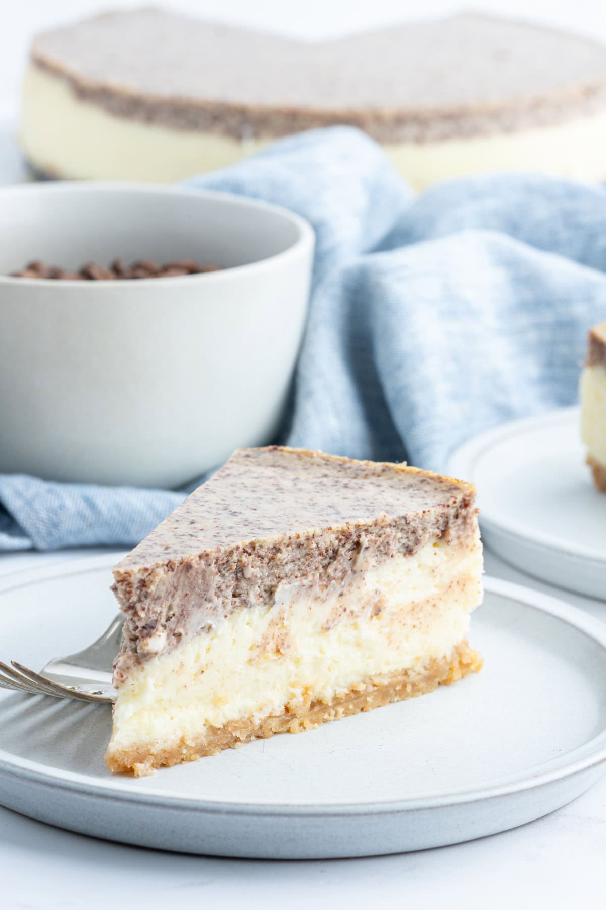 plate of tiramisu cheesecake slice