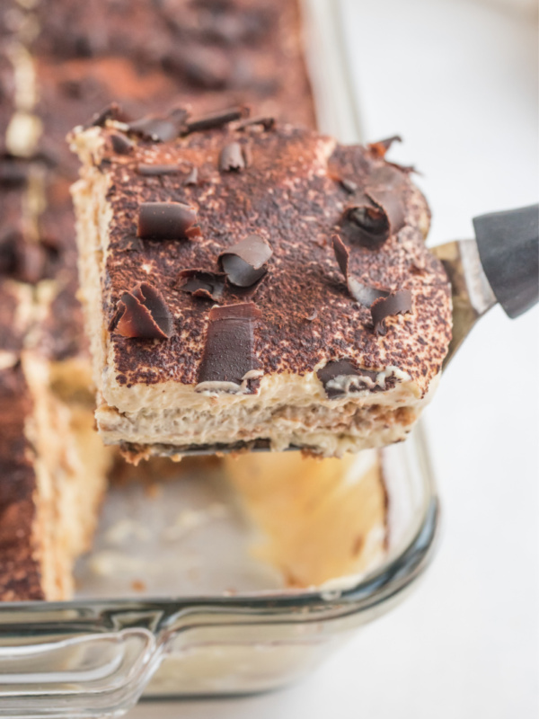 spatula taking slice of tiramisu out of pan