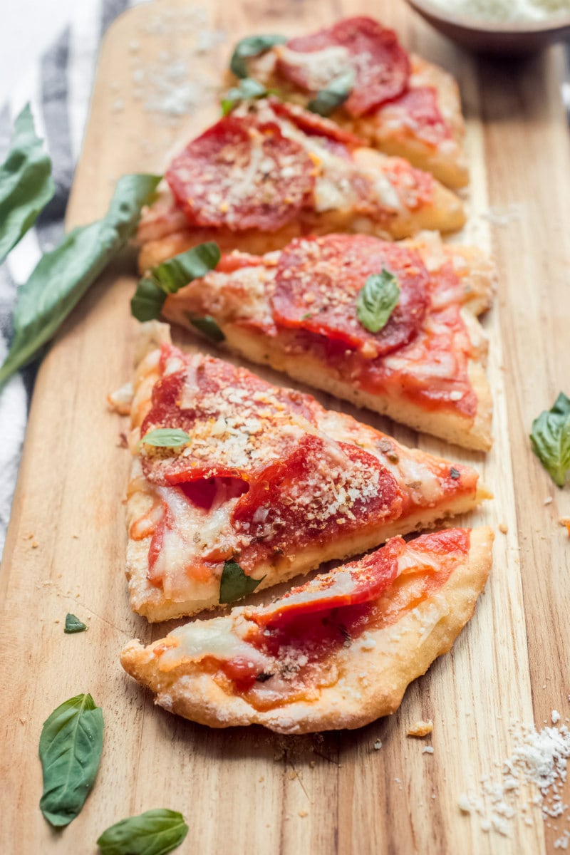 Slices of Weight Watchers Pizza on a cutting board