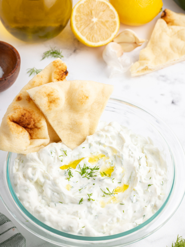 tzatziki sauce in a bowl with pita chips