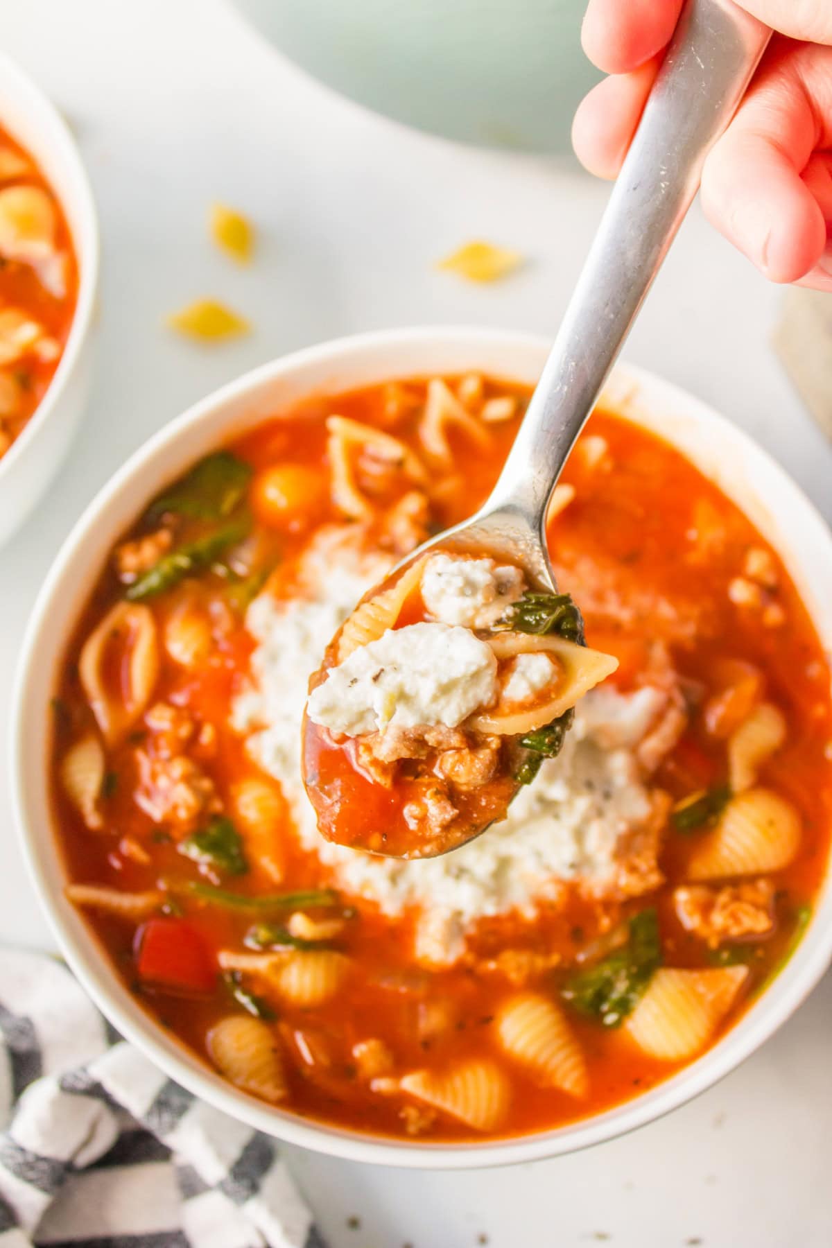 spoon in unstuffed shells bowl of soup