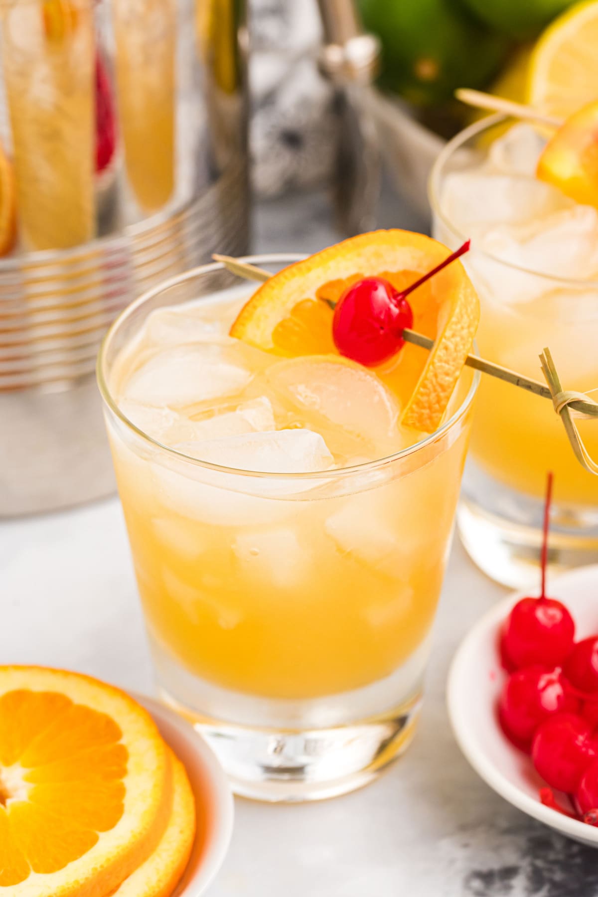 whiskey sour in a cocktail glass with garnishes