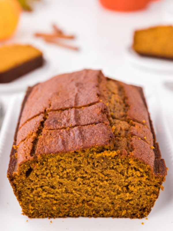 loaf of pumpkin bread cut open to see inside